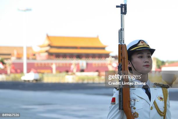Female member of an honor guard looks on during a welcoming ceremony for Singapore Prime Minister, Lee Hsien Loong outside the Great Hall of the...
