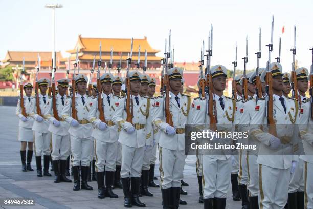 Members of an honor guard march during a welcoming ceremony for Singapore Prime Minister, Lee Hsien Loong outside the Great Hall of the People on...