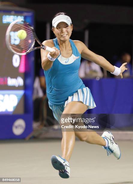 Japan's Risa Ozaki returns the ball to Shelby Rogers of the United States in the first round of the Toray Pan Pacific Open tennis in Tokyo on Sept....