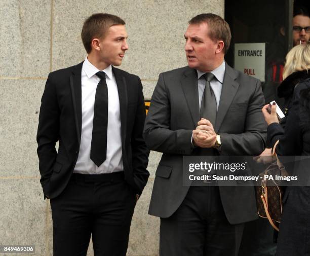 Defendant Anton Rodgers with his father Brendan Rodgers, outside the Old Bailey, London, who along with three other footballers is accused of sexual...