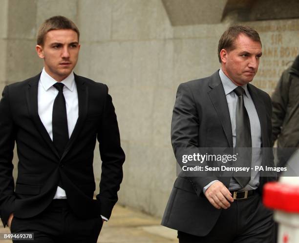 Defendant Anton Rodgers with his father Brendan Rodgers, outside the Old Bailey, London, who along with three other footballers is accused of sexual...