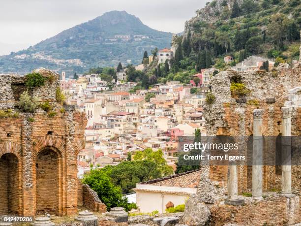 amphitheatre ruins, teatro antico di taormina. - teatro antico stock pictures, royalty-free photos & images