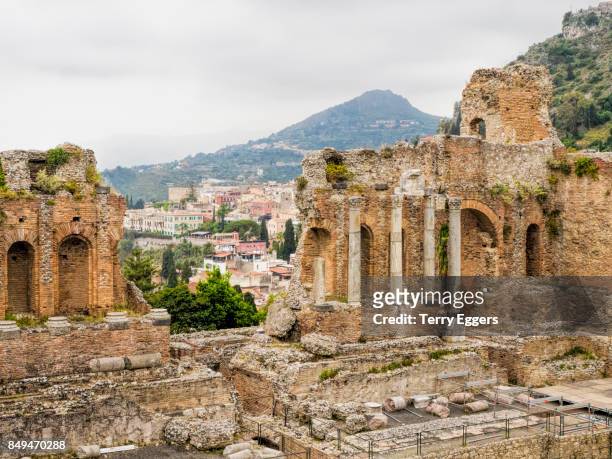 amphitheatre ruins, teatro antico di taormina. - teatro antico stock pictures, royalty-free photos & images