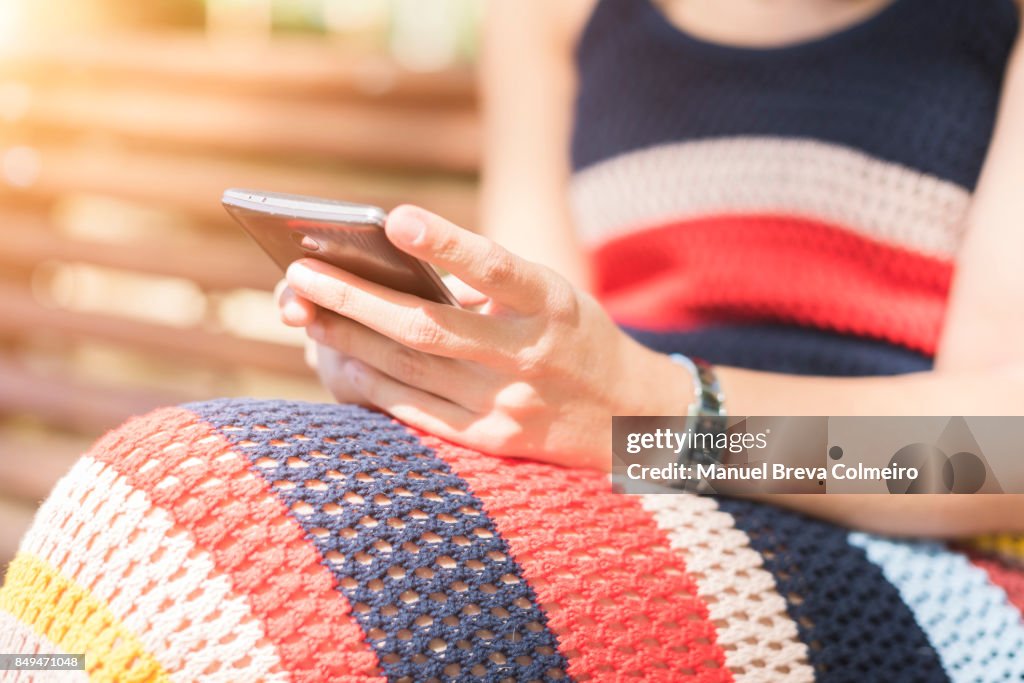 Teenage girl using a smart phone