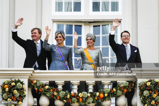 Netherland's King Willem-Alexander, Queen Maxima, Princess Laurentien and Prince Constantijn wave to the crowd from the balcony of the Palace...