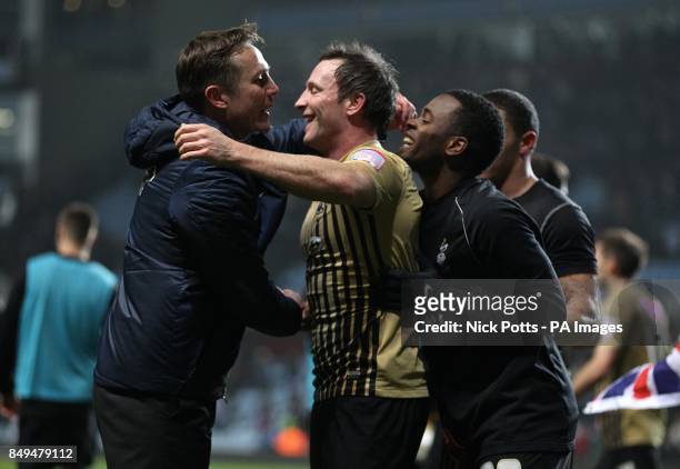 Bradford City's manager Phil Parkinson celebrates with his players after the game