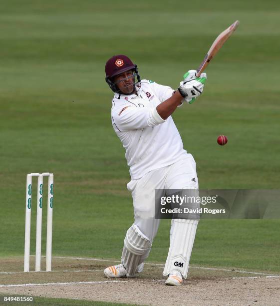 Rory Kleinveldt of Northamptonshire hits four runs during the Specsavers County Championship Division Two match between Northamptonshire and...