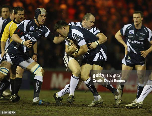 Chris Bell of Sale is tackled by Shaun Perry during the Guinness Premiership match between Sale Sharks and Bristol at Edgeley Park on February 20th,...