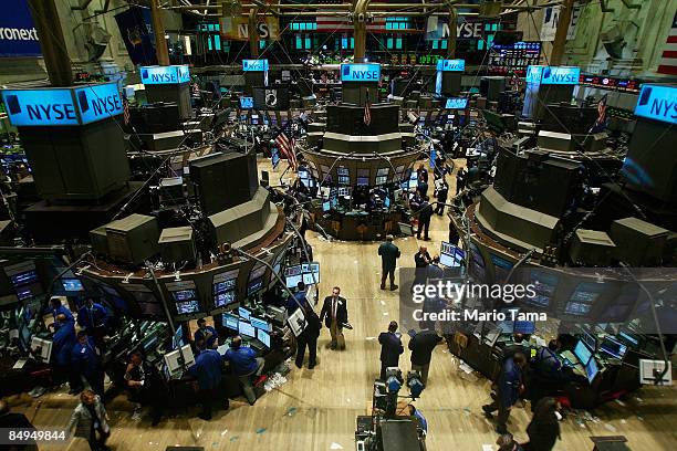 Traders work on the floor of the New York Stock Exchange during afternoon trading February 20, 2009 in New York City. The Dow closed down 100 points...