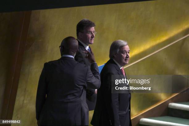 Antonio Guterres, United Nations secretary general, right, arrives to speak at the UN General Assembly meeting in New York, U.S., on Tuesday, Sept....