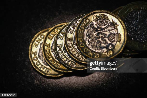 Stack of one pound sterling coins sit in this arranged photograph in London, U.K., on Tuesday, Sept. 19, 2017. Strategists are revising their...