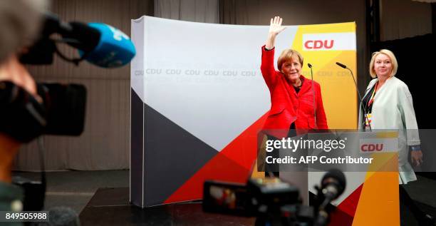 German Chancellor and Christian Democratic Union's main candidate Angela Merkel waves as she arrives at an election rally in Wismar, northern Germany...