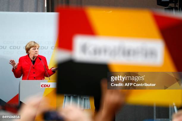 German Chancellor and Christian Democratic Union's main candidate Angela Merkel delivers her speech during an election rally in Wismar, northern...