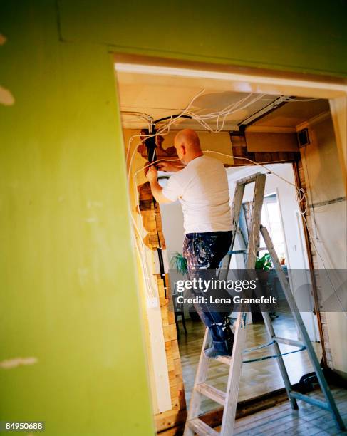 a carpenter working at home sweden. - electrician wiring home stock pictures, royalty-free photos & images