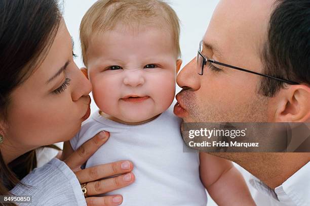 close-up of a young woman and a mid adult man loving their baby boy, zacatecas, mexico - frida karlson bildbanksfoton och bilder