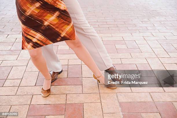 low section view of a couple dancing - padiglione foto e immagini stock