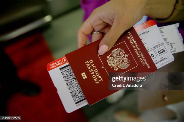 Ticket of Turkish Airlines is seen in a Russian passenger's passport at the Vnukovo International Airport in Moscow, Russia, on September 19, 2017.