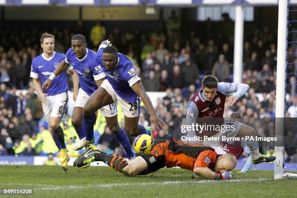 Aston Villa goalkeeper Bradley Guzan denies Everton's Victor Anichebe a chance on goal