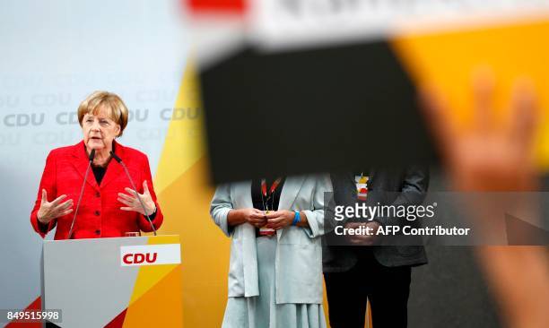 German Chancellor and Christian Democratic Union's main candidate Angela Merkel delivers a speech at an election rally in Wismar, northern Germany on...