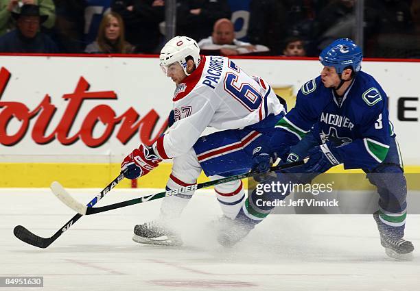 Kevin Bieksa of the Vancouver Canucks keeps Max Pacioretty of the Montreal Canadiens in check during their game at General Motors Place on February...