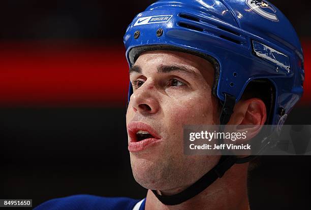 Willie Mitchell of the Vancouver Canucks looks on from the bench during their game against the Montreal Canadiens at General Motors Place on February...