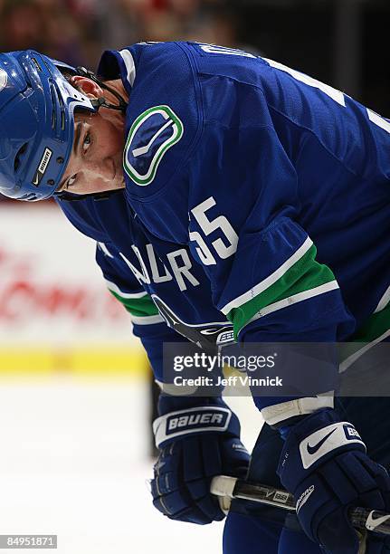 Shane O'Brien of the Vancouver Canucks looks on from the bench during their game against the Montreal Canadiens at General Motors Place on February...