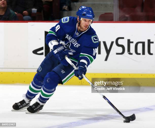 Ryan Johnson of the Vancouver Canucks skates up ice with the puck during their game against the Montreal Canadiens at General Motors Place on...