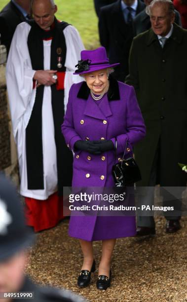 Queen Elizabeth II and the Duke of Edinburgh leave St Peter and St Paul church in West Newton, on the royal Sandringham estate in Norfolk.