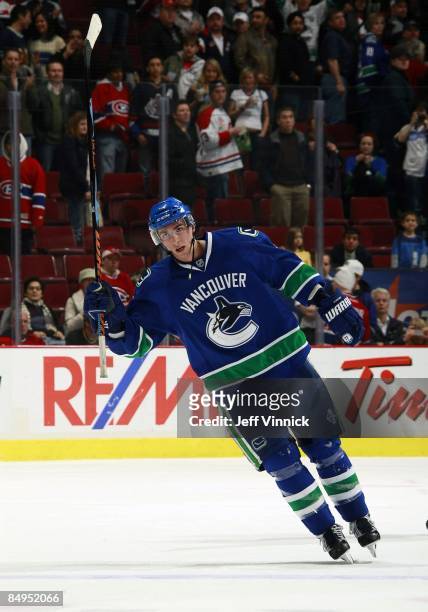 Alex Burrows of the Vancouver Canucks waves to fans after being named a star during their game against the Montreal Canadiens at General Motors Place...