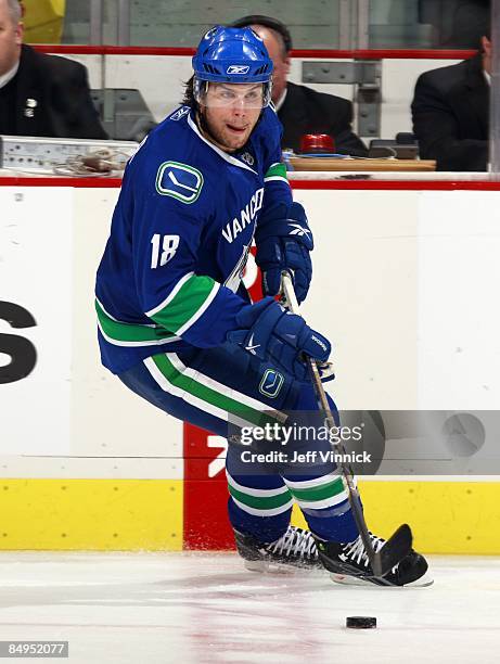 Steve Bernier of the Vancouver Canucks skates up ice with the puckÊduring their game against the Montreal Canadiens at General Motors Place on...