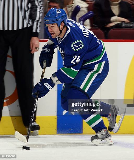 Darcy Hordichuk of the Vancouver Canucks skates up ice with the puckÊduring their game against the Montreal Canadiens at General Motors Place on...