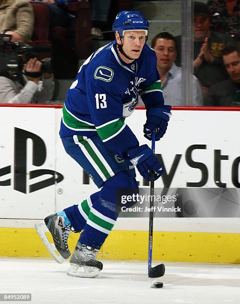 Mats Sundin of the Vancouver Canucks skates up ice with the puck during their game against the Montreal Canadiens at General Motors Place on February...