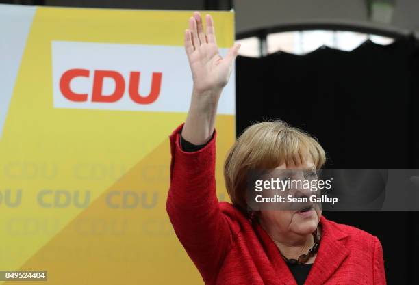 German Chancellor and Christian Democrat Angela Merkel waves upon her arrival at an election campaign stop on September 19, 2017 in Wismar, Germany....