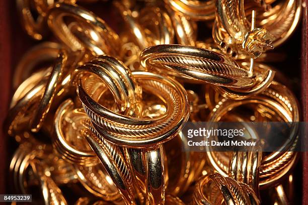 Gold earrings are displayed for sale February 20, 2009 in Los Angeles, California. Gold futures finished the day above $1,000 an ounce for the first...