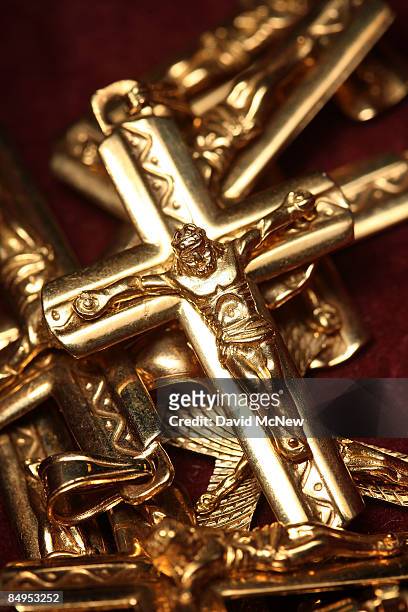 Gold crosses for sale are displayed February 20, 2009 in Los Angeles, California. Gold futures finished the day above $1,000 an ounce for the first...