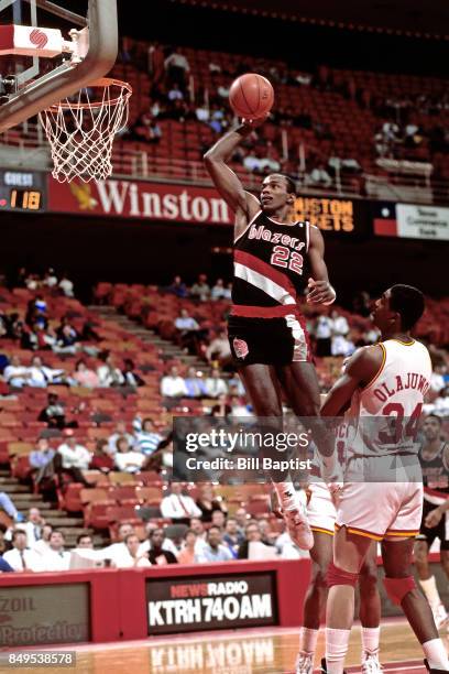 Clyde Drexler of the Portland Trail Blazers dunks circa 1990 at the Summitt in Houston, Texas. NOTE TO USER: User expressly acknowledges and agrees...