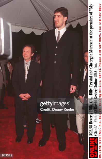 Beverly Hills, CA. Billy Crystal and Gheorghe Muresan at the premiere of "My Giant."