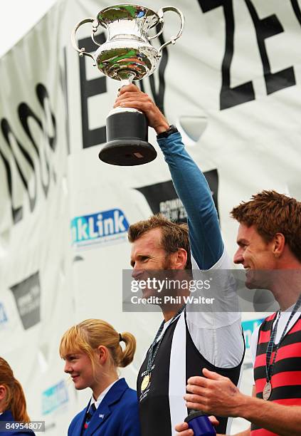 Mahe Drysdale of Auckland holds up the winners trophy after winning the final of the Mens Premier Single Scull during day five of the New Zealand...