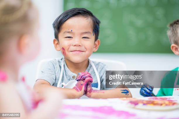 smug boy - kids arts and crafts stock pictures, royalty-free photos & images