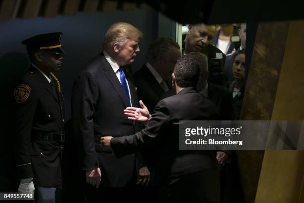 President Donald Trump, center, arrives to speak during the UN General Assembly meeting in New York, U.S., on Tuesday, Sept. 19, 2017. Trump told...