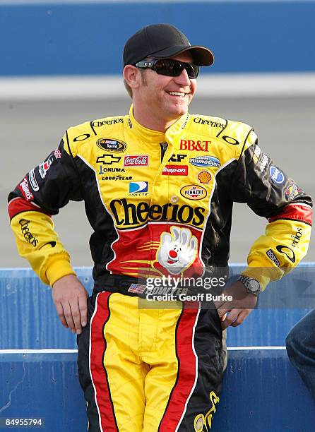 Clint Bowyer, driver of the Cheerios/Hamburger Helper Chevrolet, watches during qualifying for the NASCAR Sprint Cup Series Auto Club 500 at Auto...