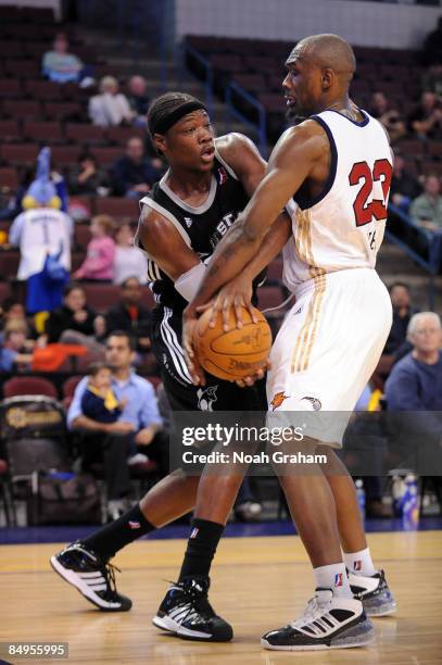Eric Dawson of the Austin Toros looks to pass against Justin Reed of the Bakersfield Jam in a NBAD League Game at the Rabobank Arena on February 19,...