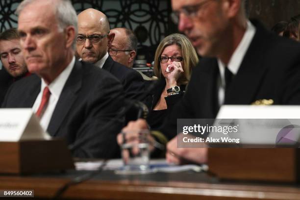 Mother Theresa Palmer of Interior Communications Electrician 3rd Class Logan Palmer, who was killed on USS John S. McCain, listens as U.S. Secretary...