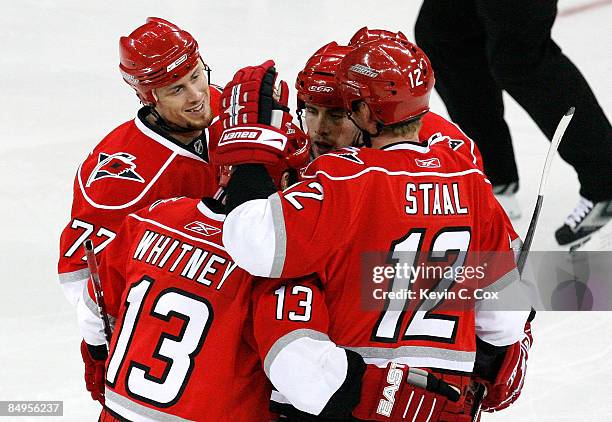 Joe Corvo of the Carolina Hurricanes celebrates his second goal with Ray Whitney, Tuomo Ruutu and Eric Staal during the game against the Tampa Bay...