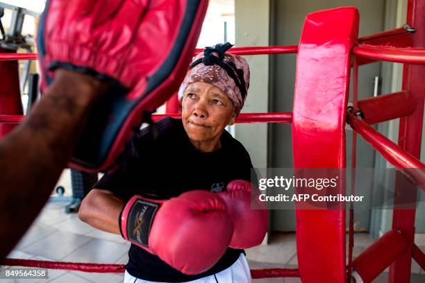 Year-old Gladys Ngwenya spars in the ring during a "Boxing Gogos" training session hosted by the A Team Gym in Cosmo City in Johannesburg on...