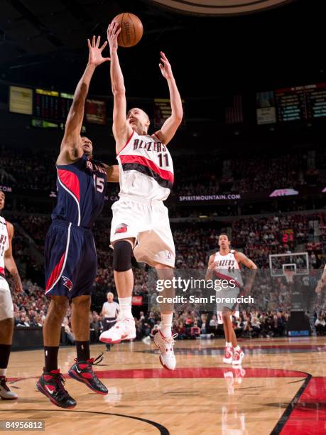 Sergio Rodriguez of the Portland Trail Blazers goes up for a shot against Al Horford of the Atlanta Hawks during a game on February 20, 2009 at the...