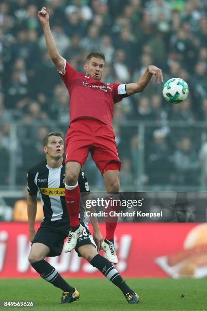 Matthias Ginter of Moenchengladbach with Simon Terodde of Stuttgart during the Bundesliga match between Borussia Moenchengladbach and VfB Stuttgart...