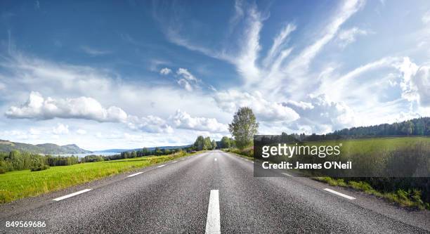 straight empty road, sweden - straßenverkehr stock-fotos und bilder
