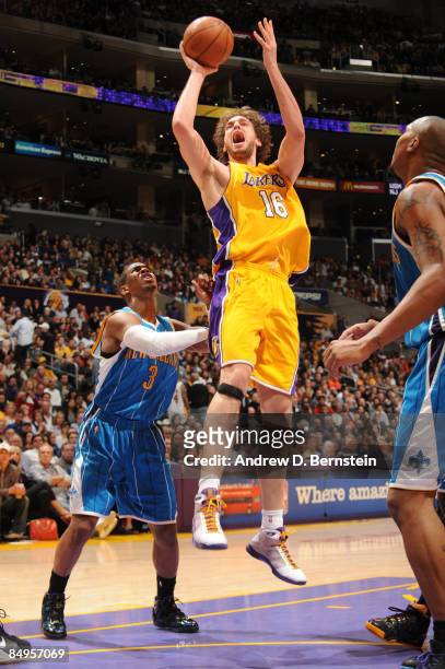 Pau Gasol of the Los Angeles Lakers puts up a shot against Chris Paul of the New Orleans Hornets at Staples Center on February 20, 2009 in Los...