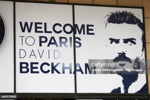 David Beckham signs hang outside the Paris Saint-Germain Club shop on The Champs-Elysees, Paris reading 'Welcome To Paris'